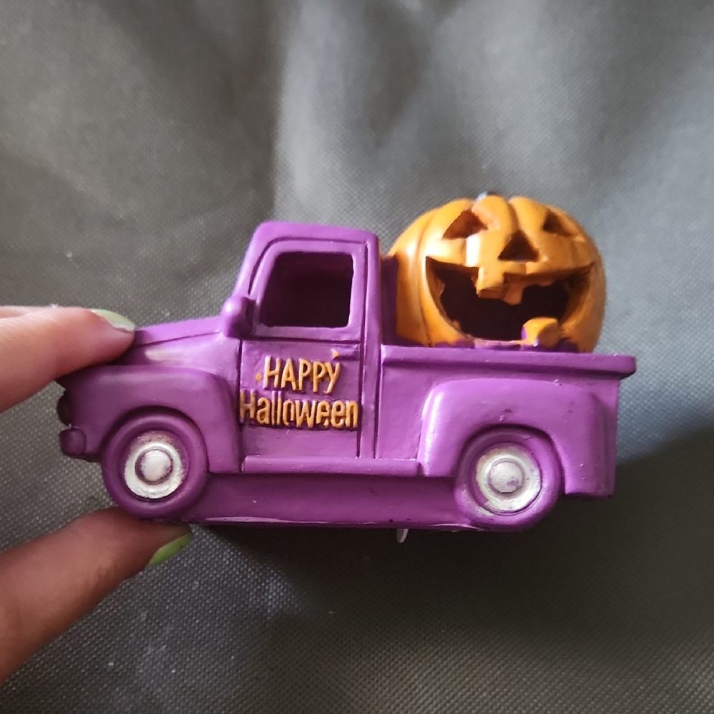 Purple Light Up Halloween Truck with Pumpkin Decor.
